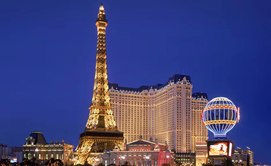 Paris Las Vegas at night, its Eiffel Tower replica and balloon sign lit up