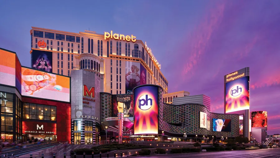 Planet Hollywood Resort & Casino exterior at dusk with the Miracle Mile Shops
